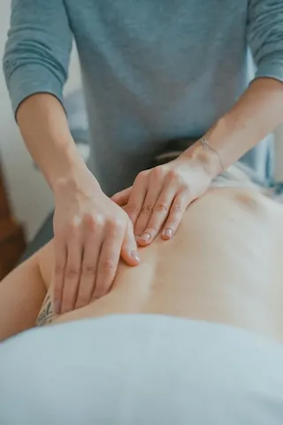 Therapist massaging a person